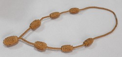Row of vintage carved wooden beads