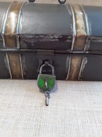 Old custom handmade metal lockable box chest with a small padlock on it