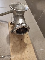 Meat grinder on wooden base