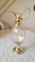 Beautifully decorated metal decanter with metal fittings