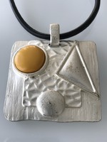 Applied art necklace with a huge pendant and a ceramic insert