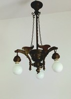 Bronze chandelier with sculptural lanterns