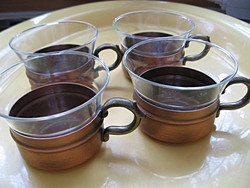 4 Heat-resistant tea and coffee Jena glasses in a massive Kupfer holder