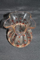 Old glass vase with orange stains