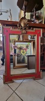 Wall mirror decorated with carvings