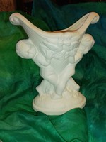 Ceramic vase with snow-white angels.