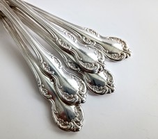Old floral silver-plated cake forks together