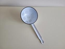 Old vintage white enamel handle filter with enameled metal pasta filter