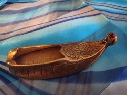 Turkish copper shoes in ashtray