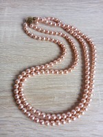 Row of pink row tekla beads