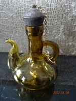 Brown glass oil pouring jug, height 13.5 cm. He has!