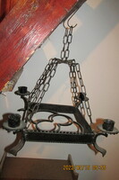 Antique four-pronged wrought iron chandelier