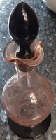 Liquor bottle with pink glass stopper