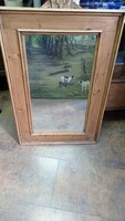 Antique mirror with full wooden back.