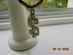 Silver plated dollar sign pendant on spring corset