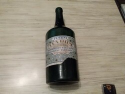 Old tea in rum bottle.