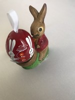 Antique plaster bunny figurine in egg holder