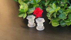 Tiny glass candle holder.