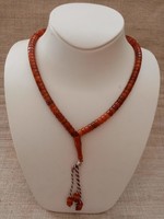 A 99-eye prayer chain made of amber-colored grains in beautiful condition
