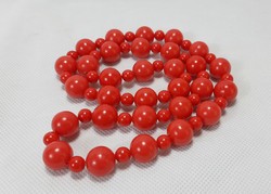 A simple red larger string of pearls