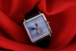 Playboy, women's elegant watch with black leather strap and new battery.