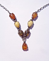 42.5 Cm. Long silver necklace with 7 amber stones
