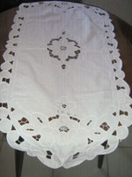 Beautiful white floral riselli sewn on lace tablecloth