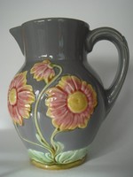 Old majolica jug with floral vintage faience marked with folk spout