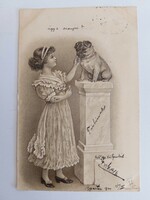 Old postcard embossed 1900 postcard with little girl puppy