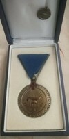 Excellent blood donation award and its small badge in a gift box