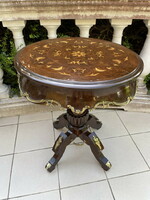 Beautifully shaped round table decorated with copper