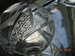 A crystal glass with a base with rich details