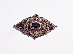 Old gold-plated silver brooch with many stones and baroque pearls