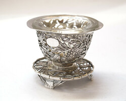 Ornate oriental silver spice holder.
