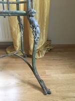 Antique iron table with putts