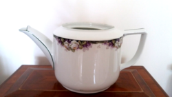Old porcelain tea pot with rose pattern vintage spout