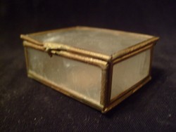 A filigree jewelry holder with mother-of-pearl luster with a copper border, a rarity