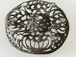 Antique silver-plated chiseled brooch with crystals, 4 cm diameter