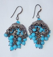 Vintage sterling silver pair of logo earrings decorated with turquoise stones
