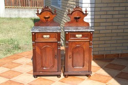 A pair of Old German marble-topped bedside tables
