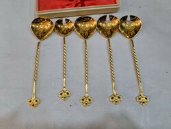 5 gilded spoons