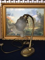 Table lamp with a frilled cover.