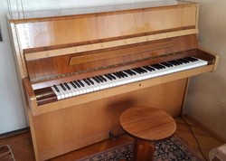 August Förster piano in excellent condition with gift piano chair