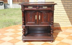 Old German richly carved chest of drawers