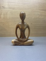 Wooden yoga sculpture