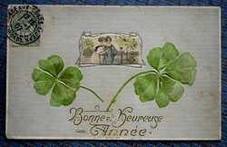 Antique art nouveau embossed greeting card for ladies in a mini silver frame with a large 4-leaf clover
