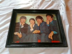 Beatles photo in frame under glass