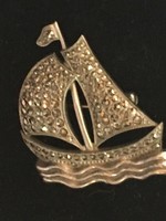 With marcasite-badge-ship_faultless mark. Shiny metal alloy