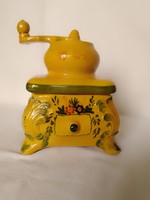 A special coffee grinder-shaped, hand-painted, sunny yellow earthenware pot from the 70s