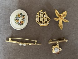 Gilded brooches, badges